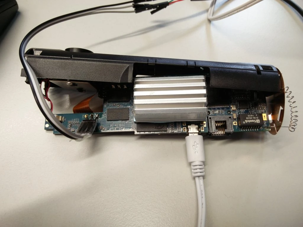 Cables connected to the serial ports on the mainboard of the camera.